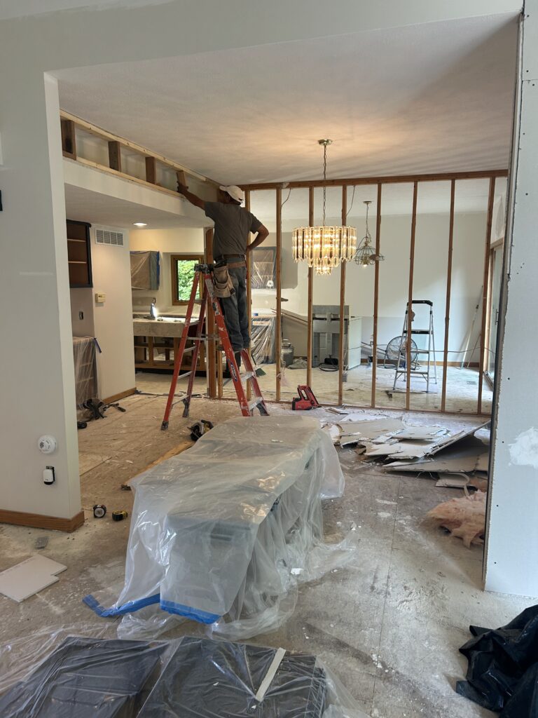 Wall between kitchen and dining room opened with studs exposed