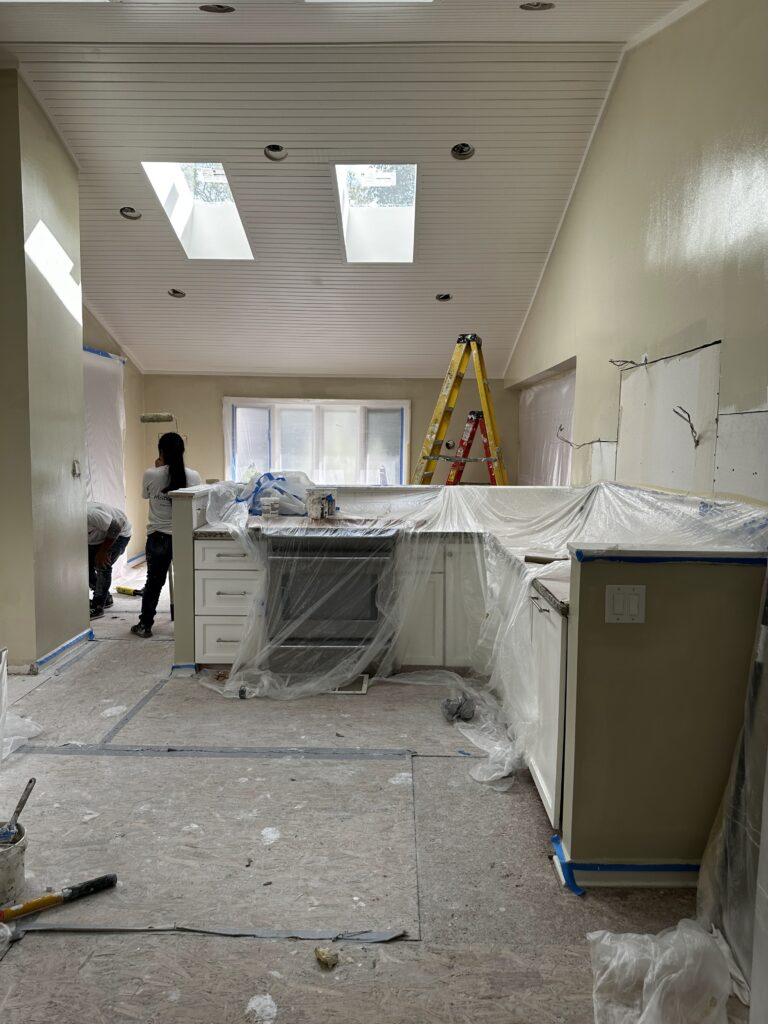 After: vaulted kitchen ceiling painted white with new wall color